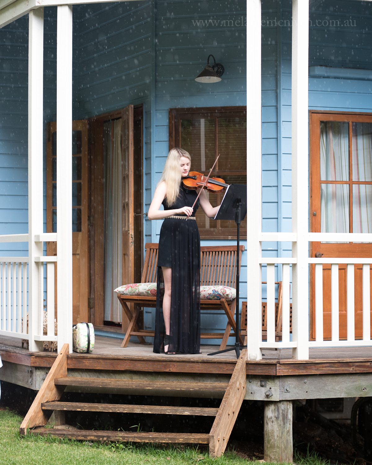 violin at wedding in rain