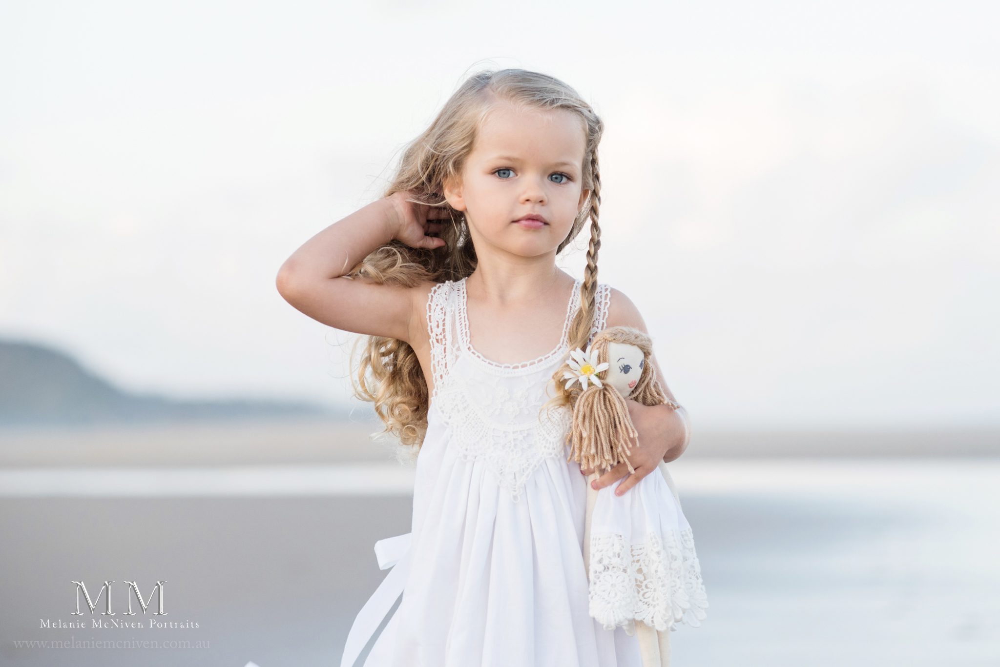 girl cuddling doll